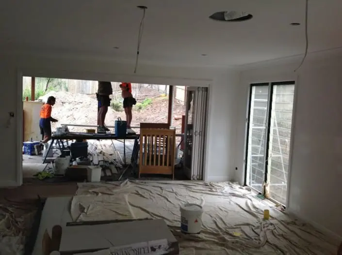 Plasterboard being installed during an interior renovation