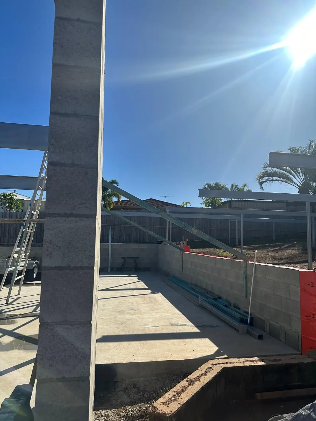 Block walls and galvanised steel beams forming a new patio structure, Brisbane