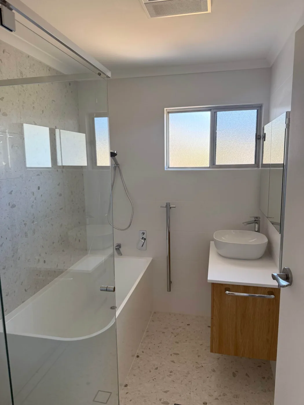 Bathroom renovation with bath, frameless shower and terrazzo tiling, Brisbane