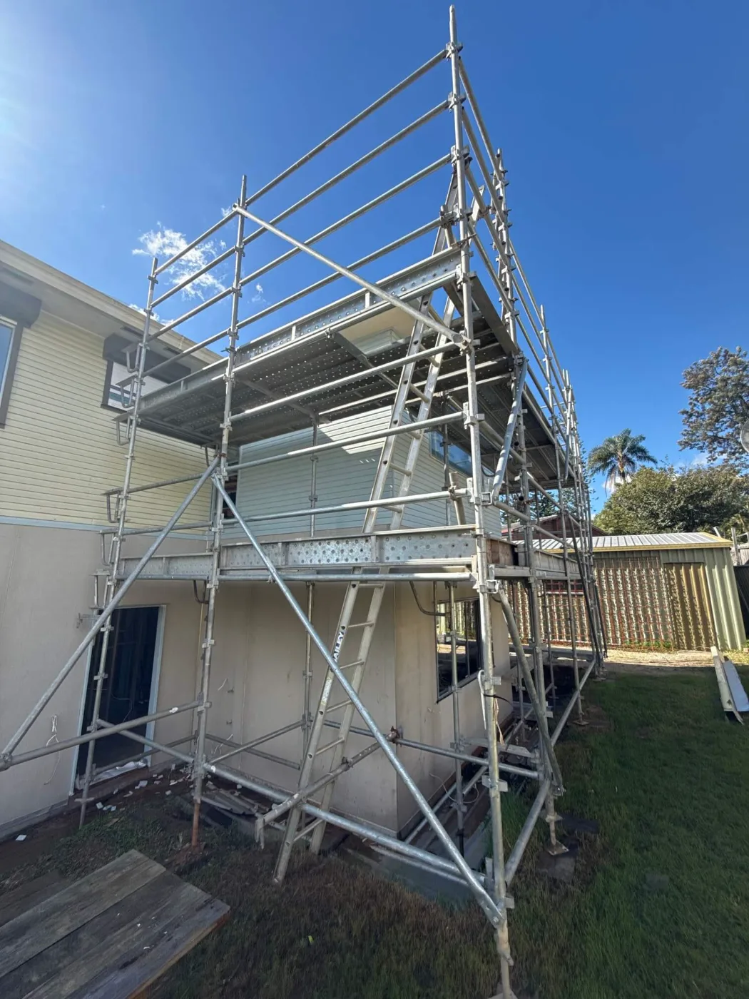 Scaffolding erected against a second-storey addition on a Brisbane home renovation