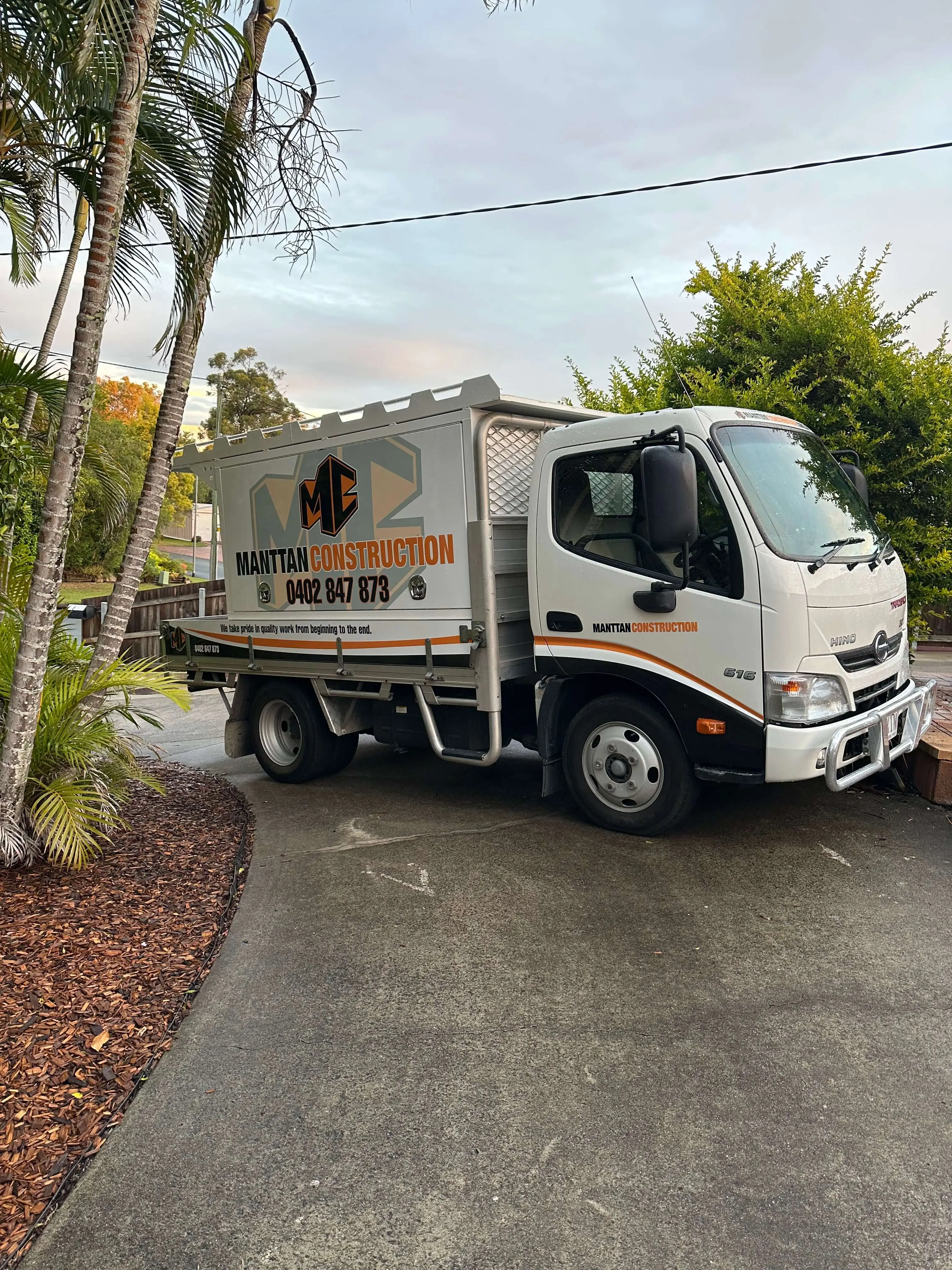 Manttan Construction Hino tipper truck parked in a Redlands driveway