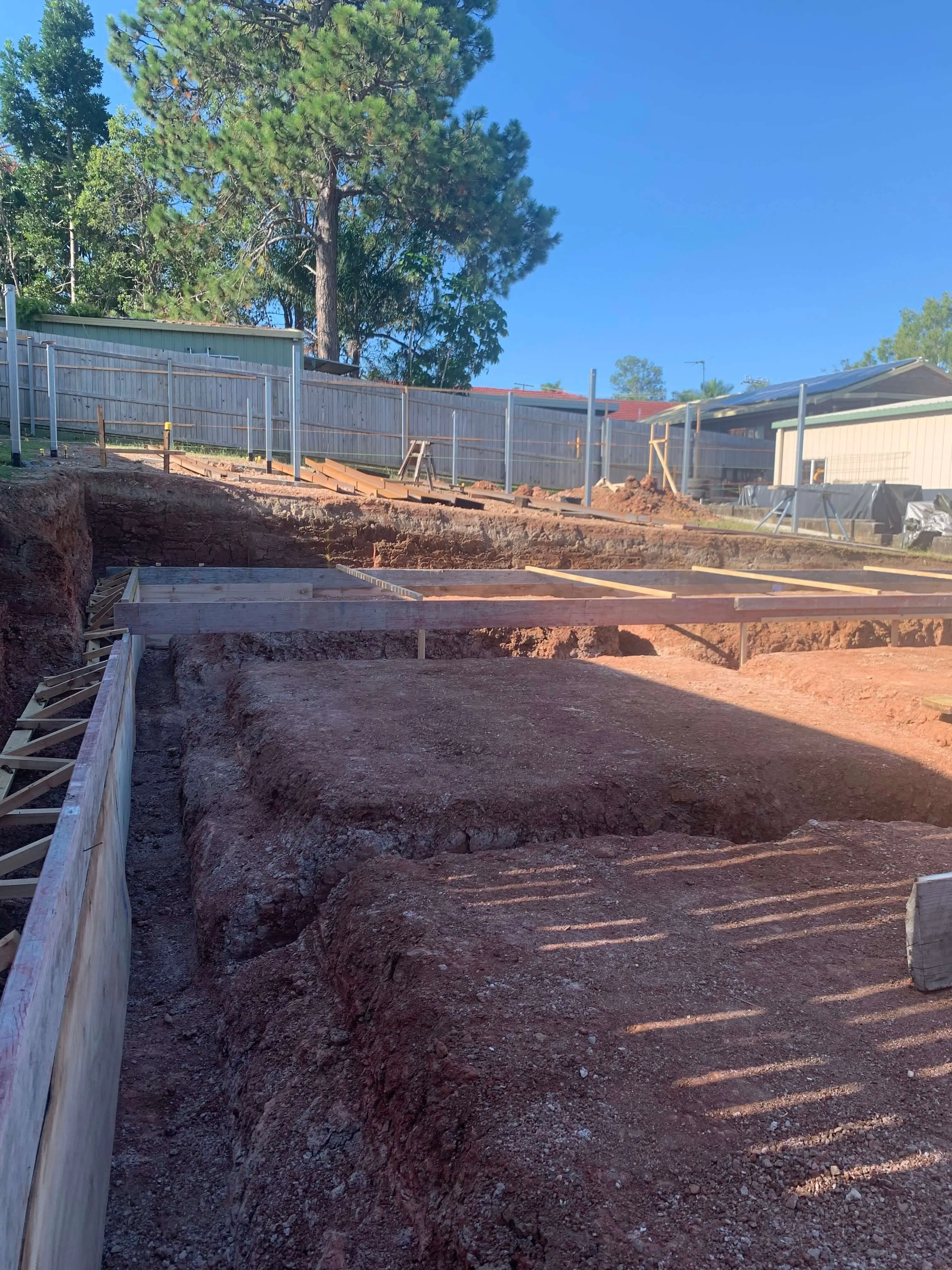 Stepped footing excavation and formwork on a sloping Redlands block